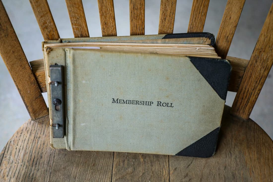 "Vintage book titled 'Membership Roll' symbolizing Premier Detailing's valued subscribers."