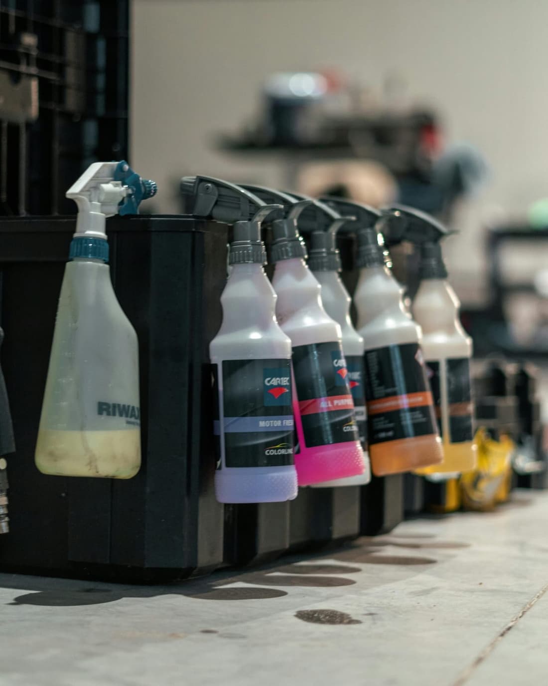 Box of detailing cleaner spray bottles for car care