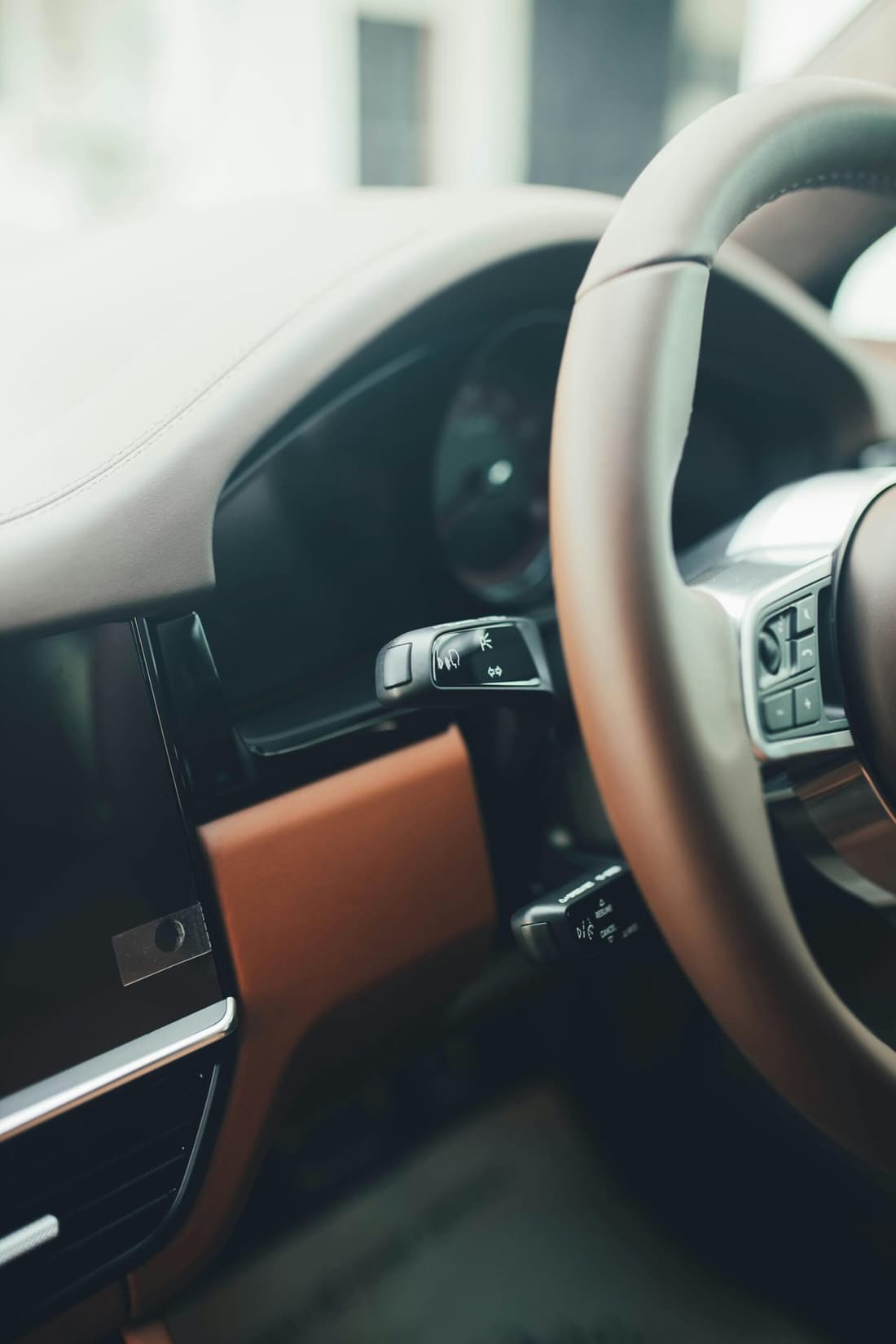 "Clean interior view of a car's steering wheel after professional odor removal by Premier Detailing."