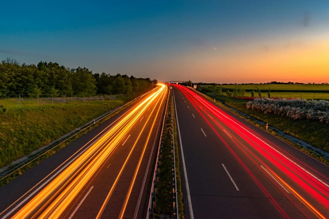 Light trails on a highway at sunset, symbolizing speed and efficiency—just like Premier Detailing’s expert car cleaning services in West Plains, MO.
