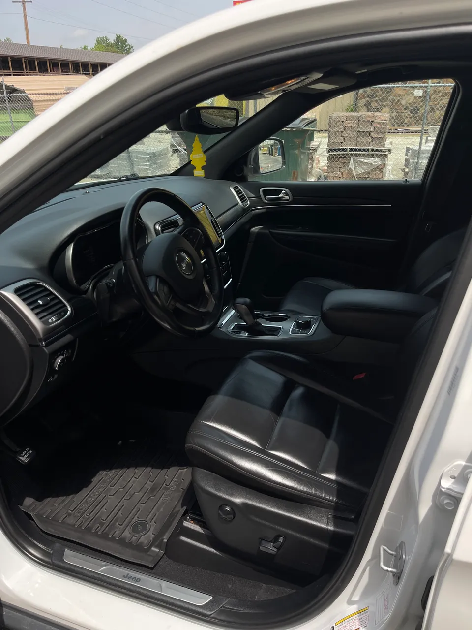 Clean black leather driver's area of a Jeep Grand Cherokee after detailing in West Plains, MO